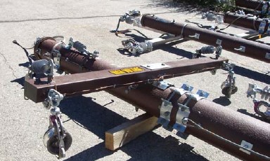 Composite poles, framed with composite crossarms, ready for helicopter transport