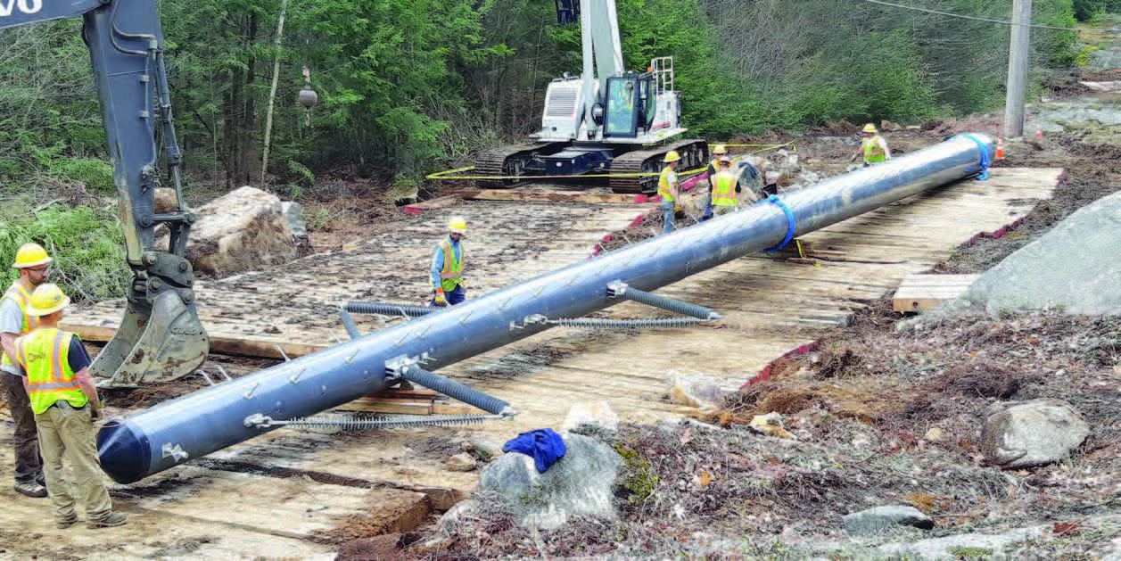 A lightweight modular composite pole being assembled for a wetland installation